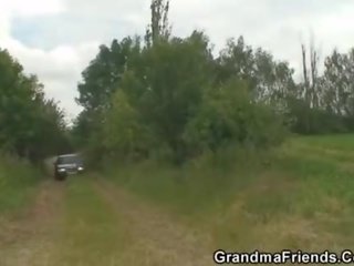 Old escort is double fucked outdoors