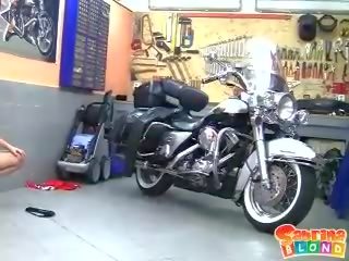 Randy blonde teen with small tits stripping by the motor bike